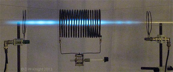 Resonating coil with axial Hg vapour tube